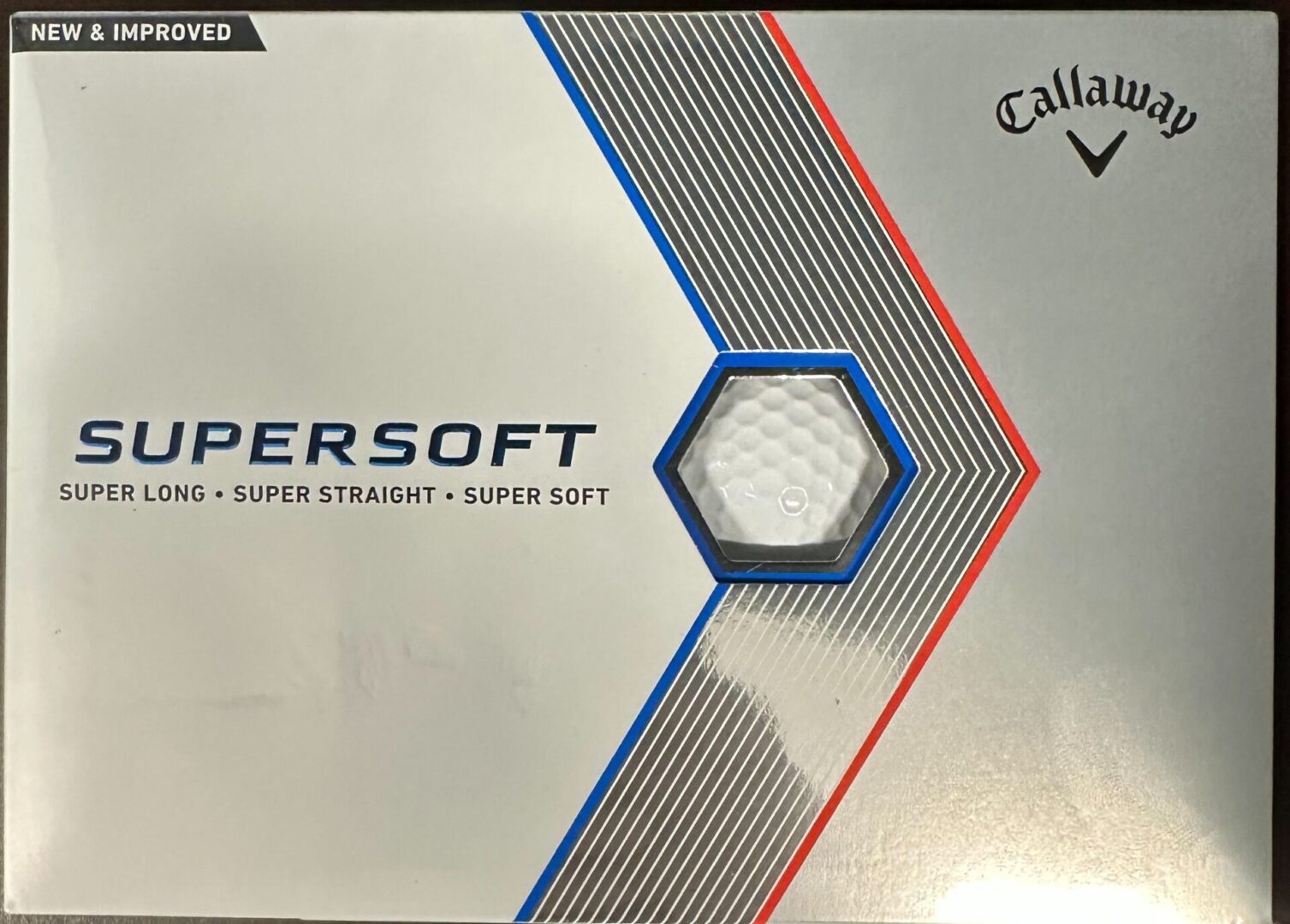 A box of golf balls that are blue and red.