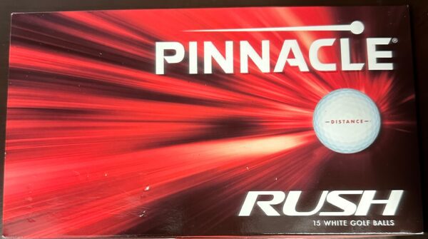 A box of pinnacle rush 1 5 golf balls