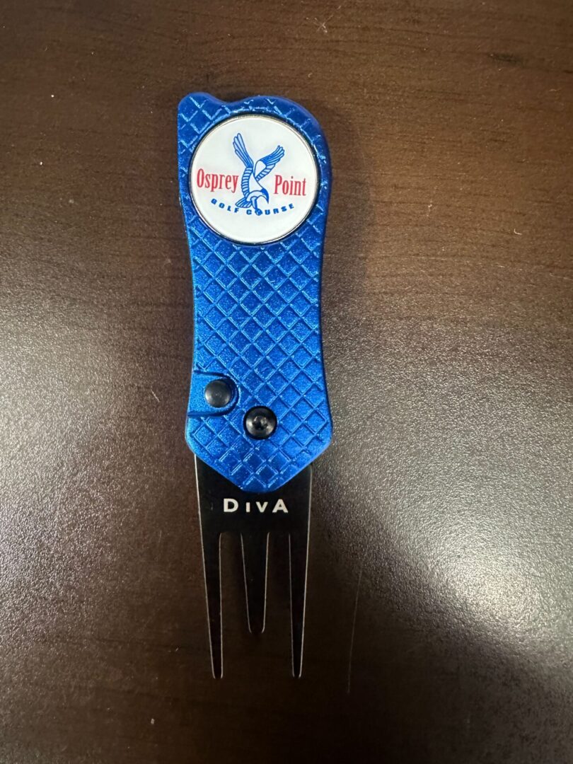 A golf divot tool with a blue handle and a white logo.