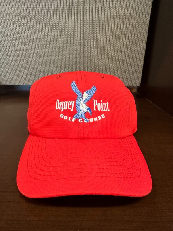 A red cap with the logo of osprey point golf course.