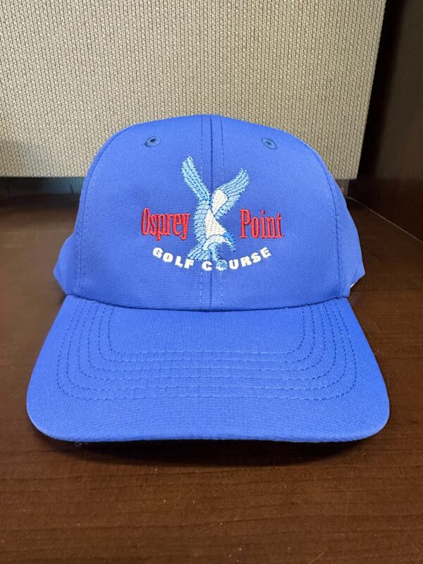 A blue cap with the words " eagle golf course."